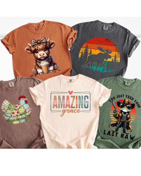 Collection of five colorful t-shirts with various designs on a white background